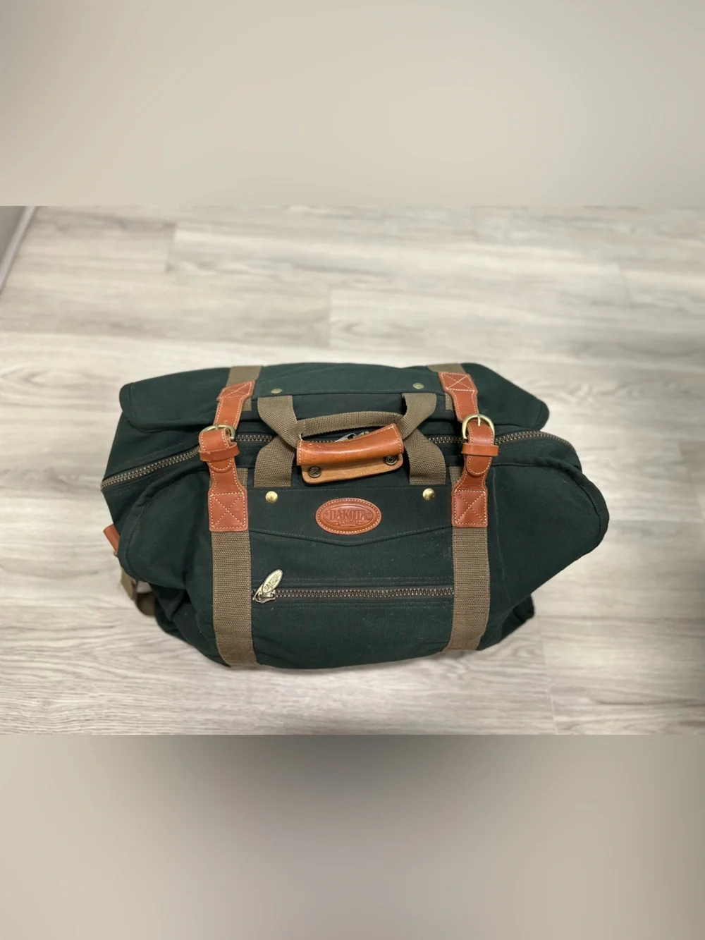 Tumi Dakota Dark Green Canvas Duffel with Tan Straps and Brown Leather Trim